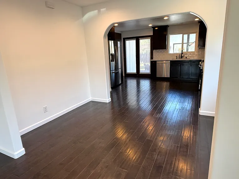 Bright dinning room filled with natural light and dimmable recessed LED lighting.