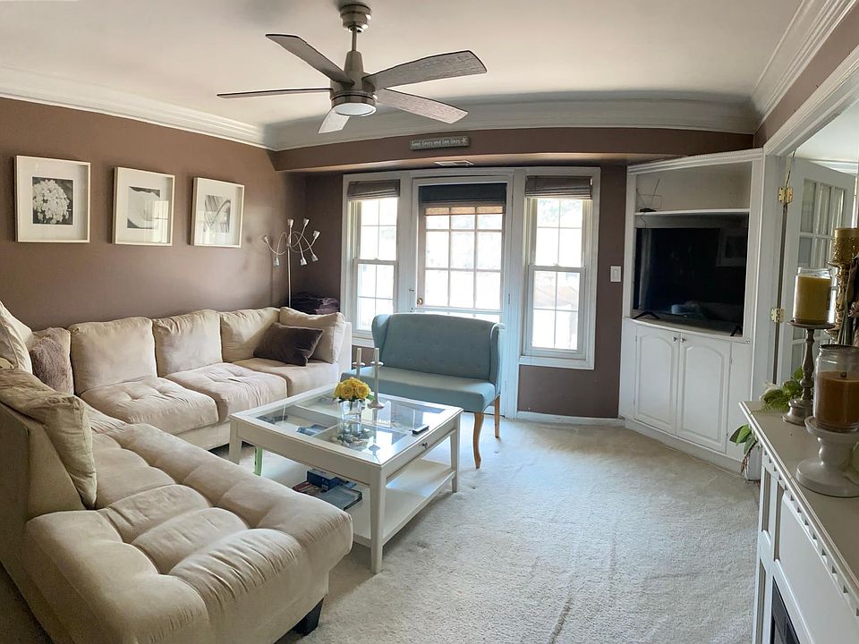Living room area with access to balcony outside (furnishings only included to show scale and decor options)
