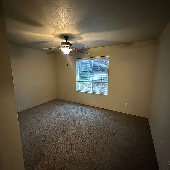 Master bedroom with ceiling fan.