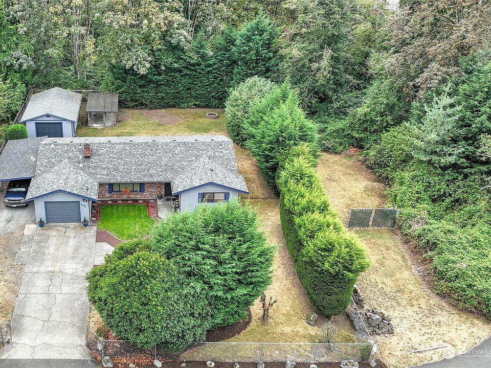 An overview of the home and property shows the unused City easement to the greenbelt behind the home.  The Sellers have maintained and used this easement area for 30 years.  It was gated by the Seller many years ago and can be used for safe RV parking and/or other storage. The Greenbelt behind the home cannot be developed so this easement has not been used by the City in all of the time the Seller has owned the property.>