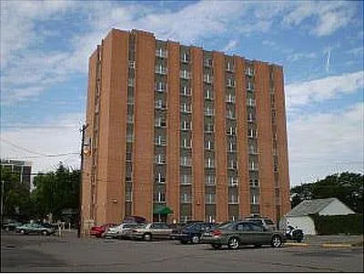Full building and parking lot - Sage Tower Apartments
