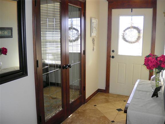 Front entry and door to office of 4th bedroom