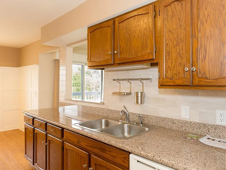 Granite counter tops with tile back splashes in all units