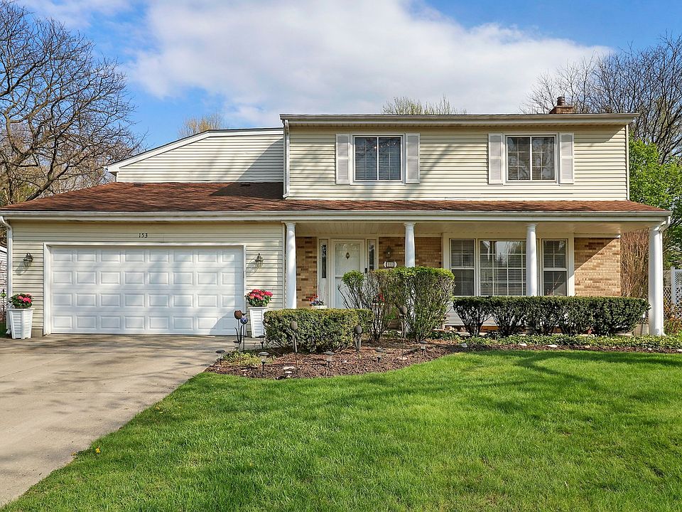 A charming front porch welcomes you to 153 PlumTre