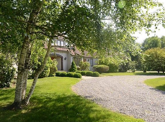 Mature landscape adds to the impressive appeal. 4300 square feet with 4 bedrooms, 4 baths and 2 powd