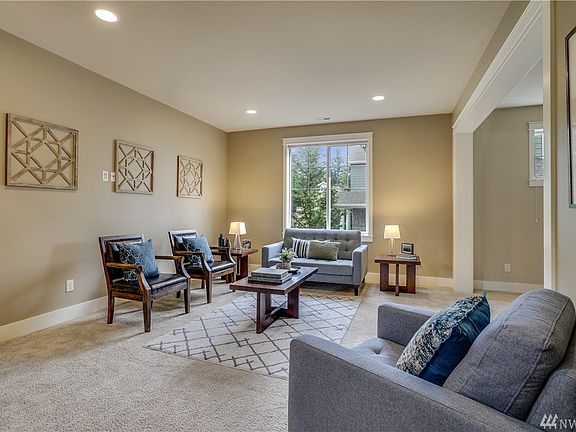 This formal living room is the perfect spot to gather and relax. Plenty of space for your personal design options. Contemporary color palette, fresh carpet and beautiful natural light. 