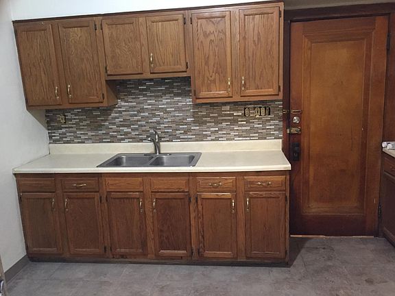New ceramic floor and glass backsplash