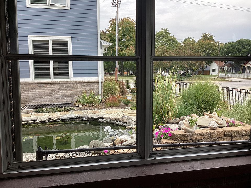 View of neighbors beautiful coy pond and landscaping from your sunporch ! 
Great view from all windows with lots of natural light throughout