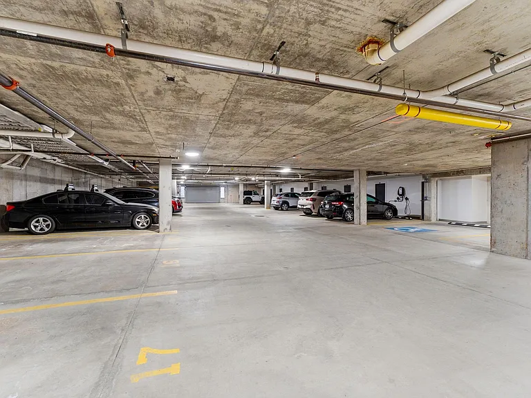 Underground parking garage with heated driveway