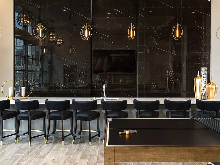 Enjoy the perfect blend of dining and entertainment in the lounge, featuring a dining area and a fun ping pong table for all to enjoy.