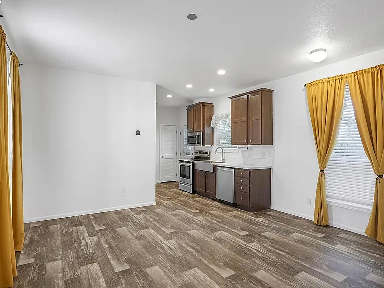 Living room/kitchen (like a studio), but both bed rooms have their own attached bathrooms and separate rooms.