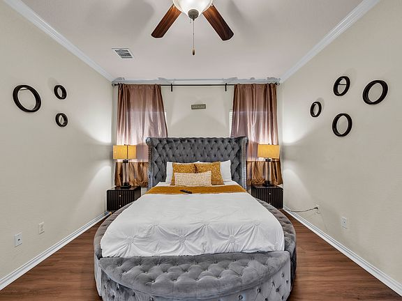 The master bedroom is equipped with a luxurious bed and a high-quality mattress for restful nights.