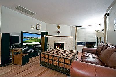 Family room with Birth Hardwoods and Impressive Italian Marble fireplace