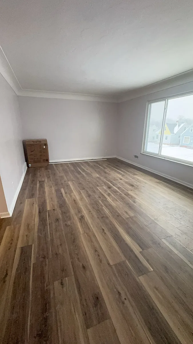 Spacious living room with large sun facing windows - 5714 Orchard Ave #UP