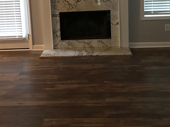 Upstairs living room with ceiling fan and vaulted ceilings