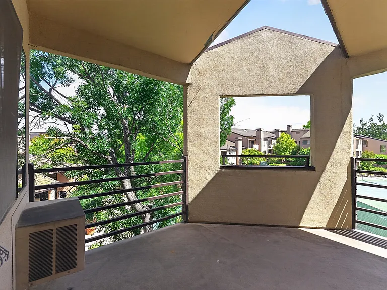 Balcony overlooking the tennis courts and swimming pool