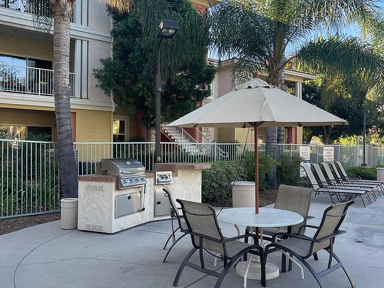 Grill area located next to pool