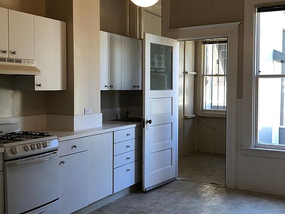 Large eat-in kitchen next to porch