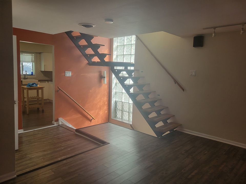 Main living area with stair to bedrooms