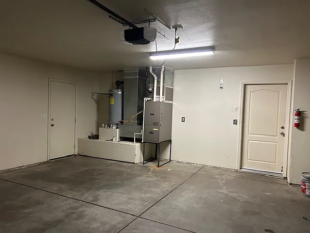 finished garage, side door to outside and door to house.