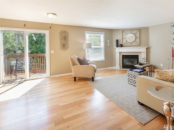 Spacious living room opens to back deck with slider.