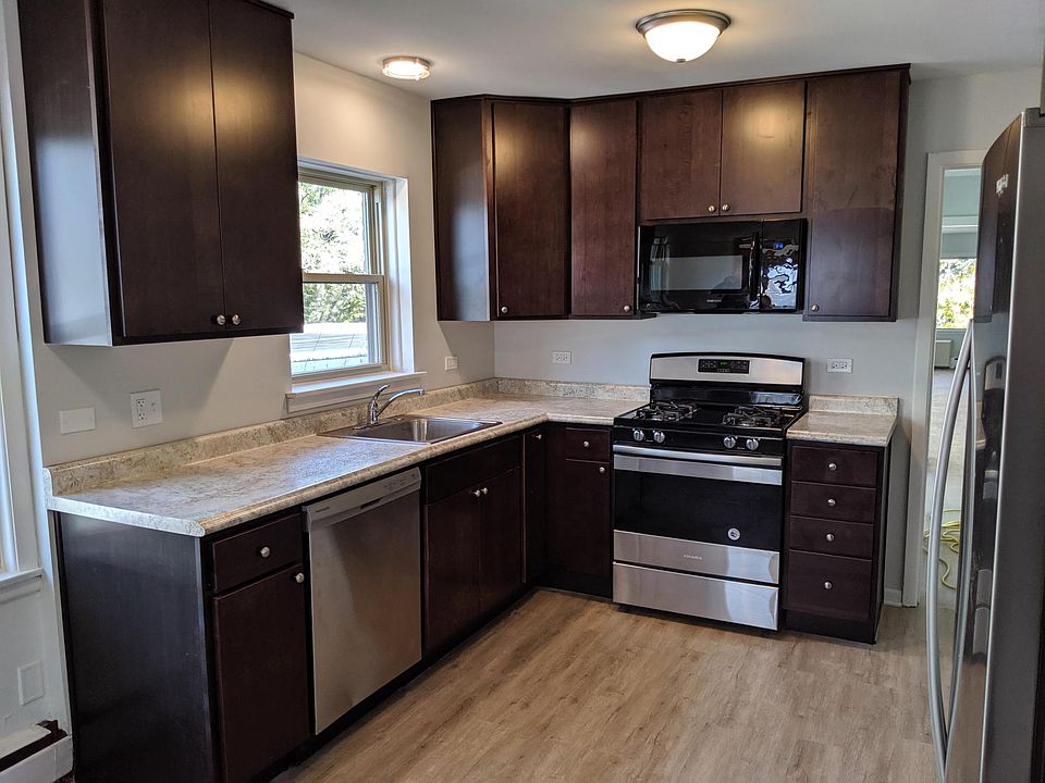 New kitchen cabinets, counter top, appliances, floors and windows