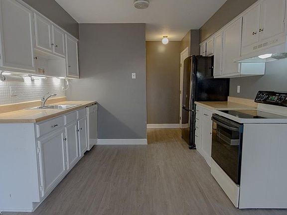 The new flooring and paint really modernize this functional Kitchen!