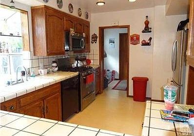 Kitchen, looking from opening in family room, dining room area.