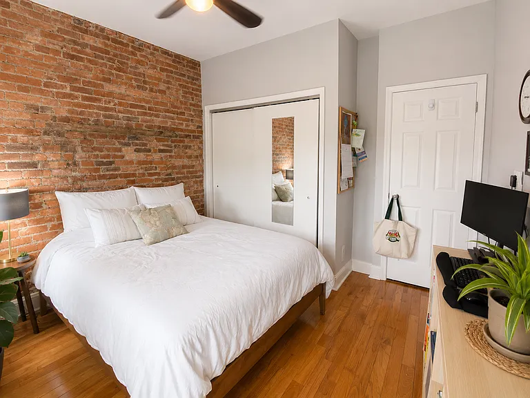 Lit with 2 large windows, exposed brick, a good sized closet and room for a desk and dresser.