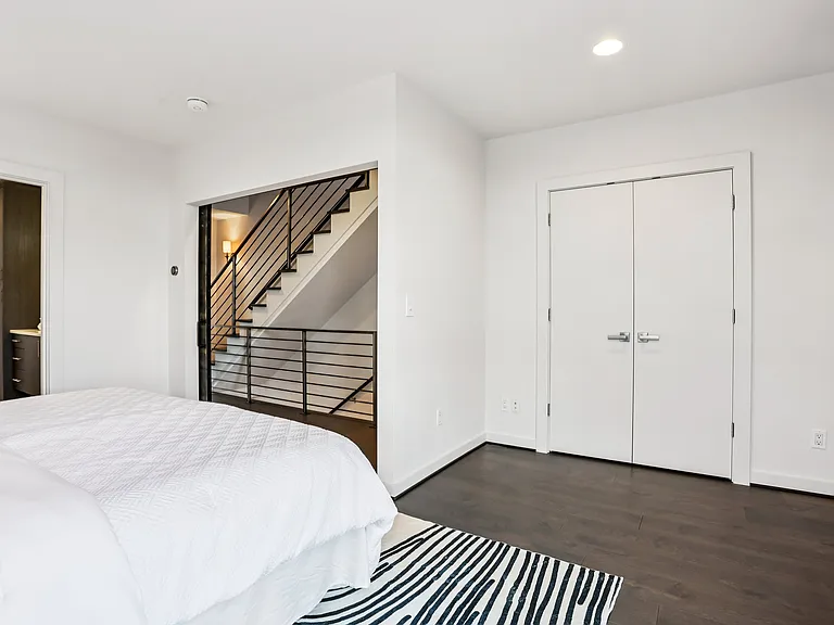Large master bedroom with built-in closet.