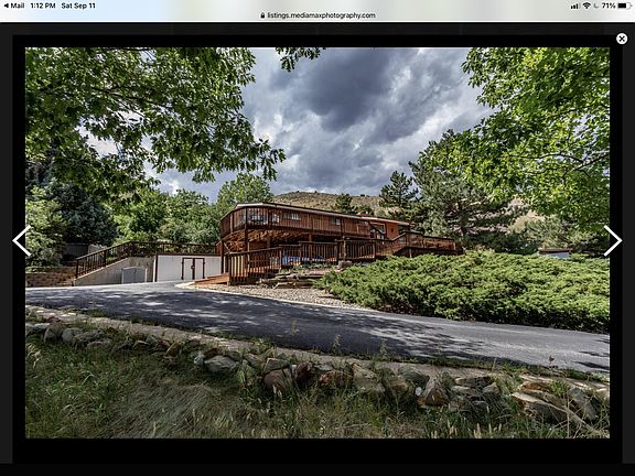 Upstairs of bilevel brick home with approximately 1,500 sq ft plus large sunroom and decks wrapping the property for panoramic views of North and South Table Mountains, Green Mountain, and downtown Golden and Denver. This view is arguably the best in the