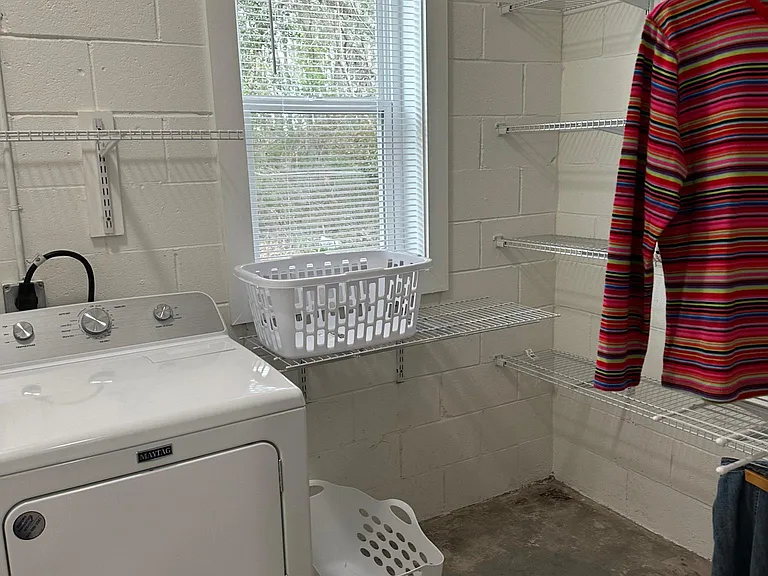 Laundry area going into Closet area with a view of the Bay! 6'x7' X 10' x 4"...