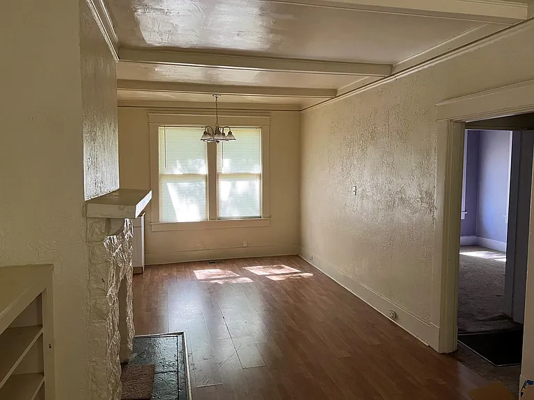dining area off of kitchen - hall to the right leads to bedrooms and bathroom