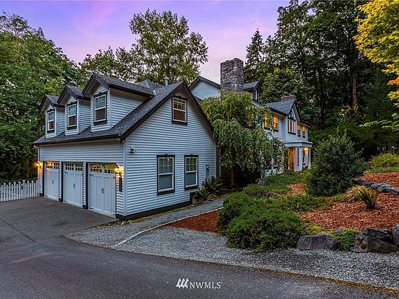 Custom built by Bruce Fine Homes, the home exudes Farmhouse charm w/ white exterior and black trim. 4 bedroom, 3 full bath, one 3/4 and one 1/2 baths.