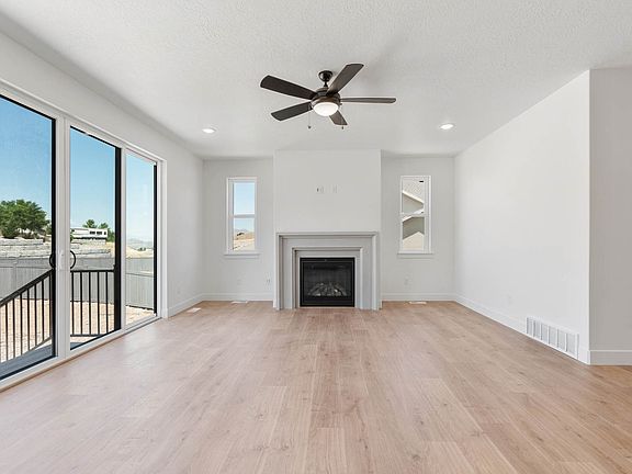 The family room is large and has lots of windows and a gas fireplace.