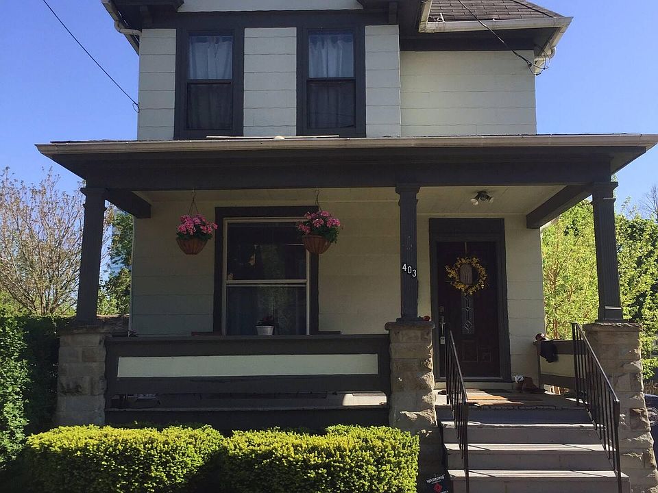 Covered front porch. Parking for 2 vehicles in side courtyard lot.
