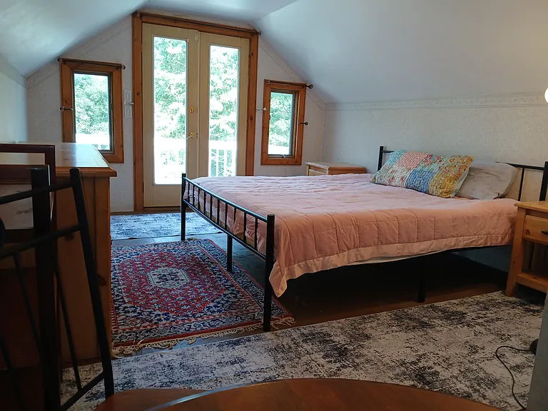 Main bedroom with private deck and walk-in closet