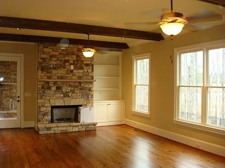 Grand Room with Beamed Ceilings has golf course views!