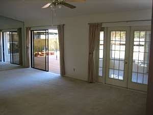 Large vaulted ceilings with sunroom and deck access