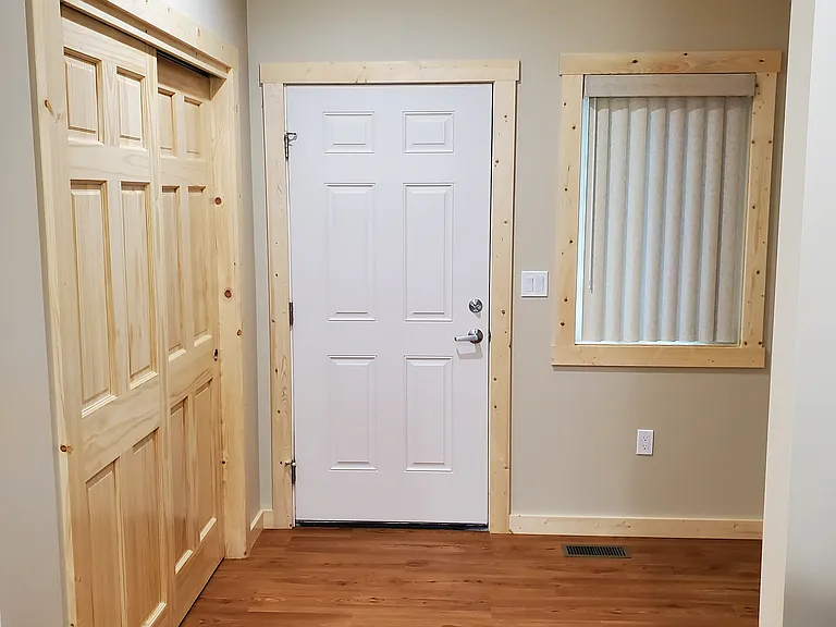 Entry area with large closet and extra space for work or play.