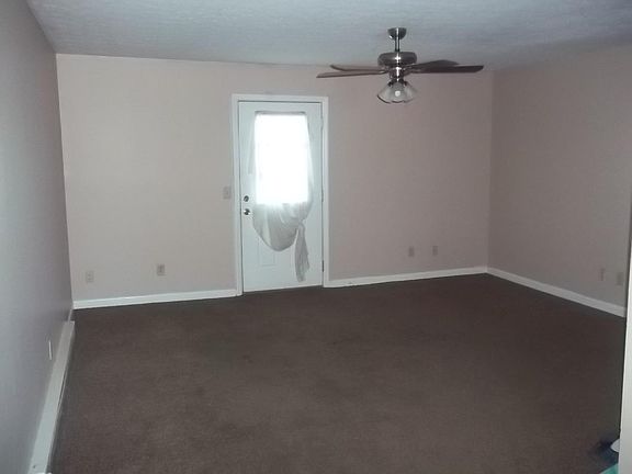 Living room with door to deck