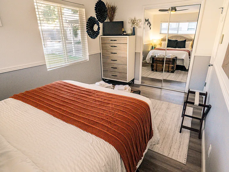 Bedroom 2 - queen bed, large dresser, medium size reach-in closet