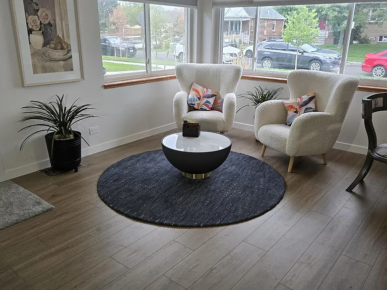 We opted for large chairs BUT this corner can easily fit your couch or L-shaped sectional, coffee table and occasional chairs. to face a large TV wall.