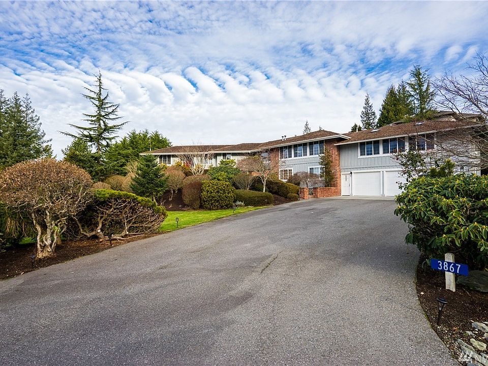 Expansive manicured grounds with 3 car garage, sprinkler system and room to roam.  Even comes with a dog run for the pets!