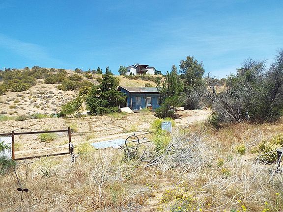 cabin with house in rear
