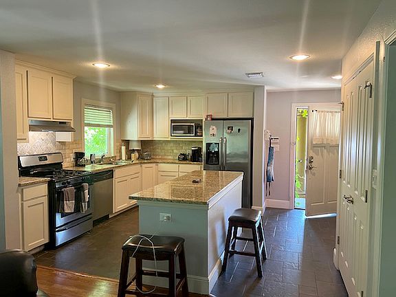 Large eat-in kitchen with gas stove and dishwasher, stainless steel appliances