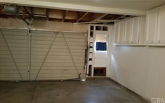 2 car garage with builtin cabinets