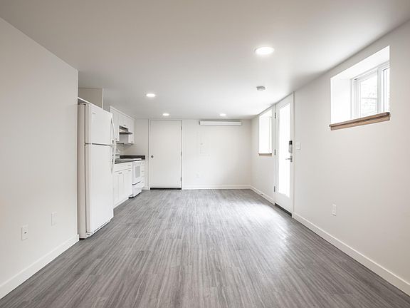 Kitchen/Living room area. Keyless entry on door. South facing windows.