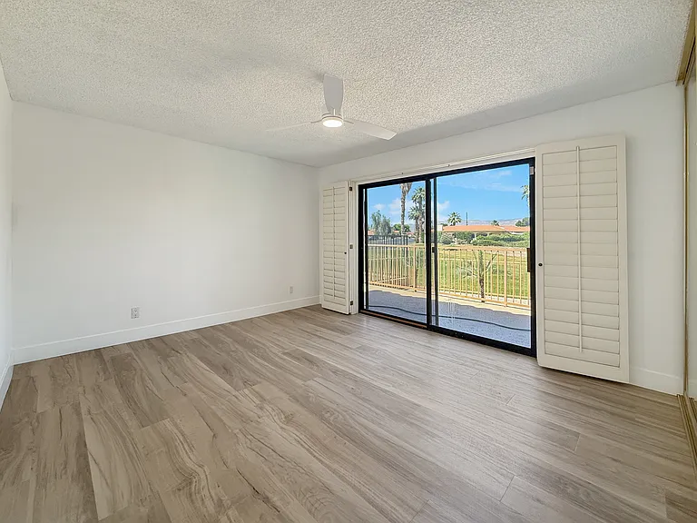 Third bedroom with golf course and pool view