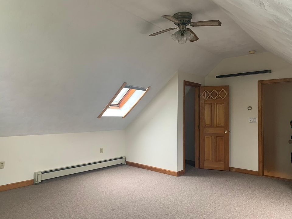 3rd floor bedroom with cathedral ceilings.